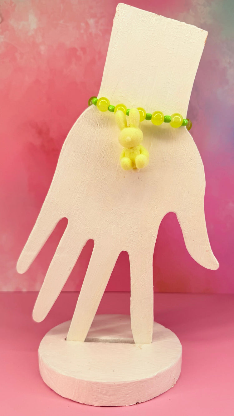 Yellow and green beaded bracelet with fuzzy bunny charm